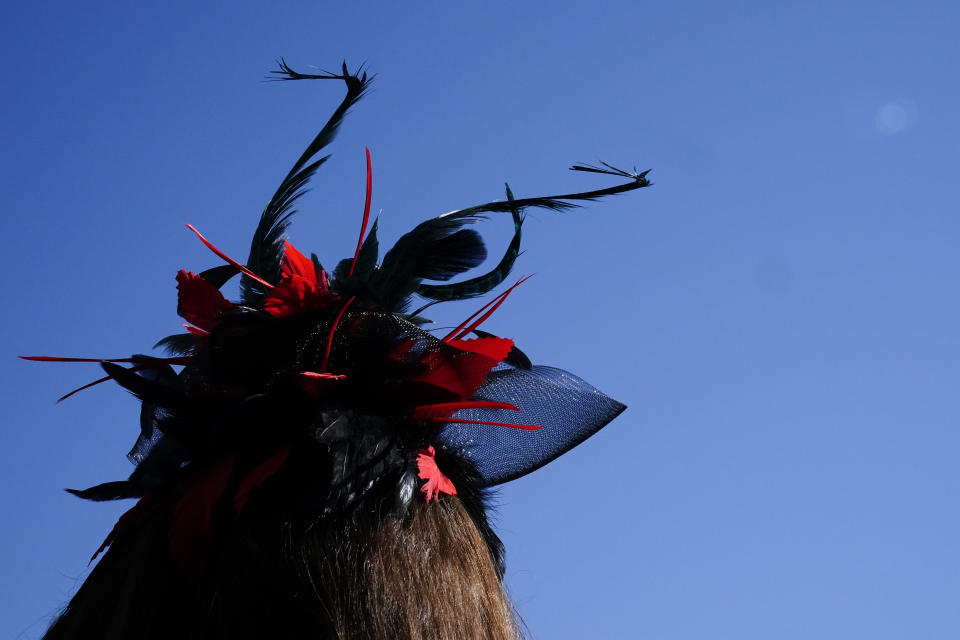 A lady wears a stylish hat before the 147th running of the Kentucky Derby at Churchill Downs, Saturday, May 1, 2021, in Louisville, Ky. (AP Photo/Brynn Anderson)
