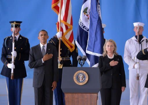 US President Barack Obama and Secretary of State Hillary Clinton listen to the National Anthem during the transfer of remains ceremony marking the return to the US of the remains of the four Americans killed in an attack this week in Benghazi, Libya, at the Andrews Air Force Base in Maryland. Clinton said their deaths were "senseless" and "unacceptable."