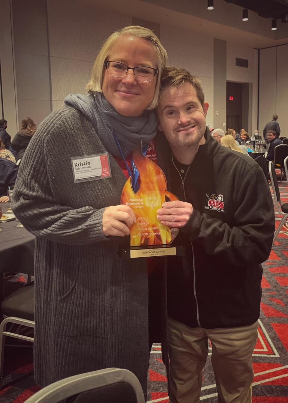 Kristin Schoonveld was named Volunteer of the Year for Special Olympics State of Indiana. She poses with her adopted son Nick.