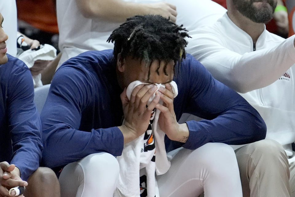 Illinois' Terrence Shannon Jr., sits on the bench at the beginning of an NCAA college basketball game against Rutgers Sunday, Jan. 21, 2024, in Champaign, Ill. A federal judge has reinstated Shannon Jr., who had been suspended from the team since he was charged with rape in Kansas last fall. (AP Photo/Charles Rex Arbogast)