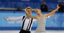 Britain's Penny Coomes (R) and Nicholas Buckland compete during the figure skating ice dance short dance program at the Sochi 2014 Winter Olympics, February 16, 2014. REUTERS/Alexander Demianchuk