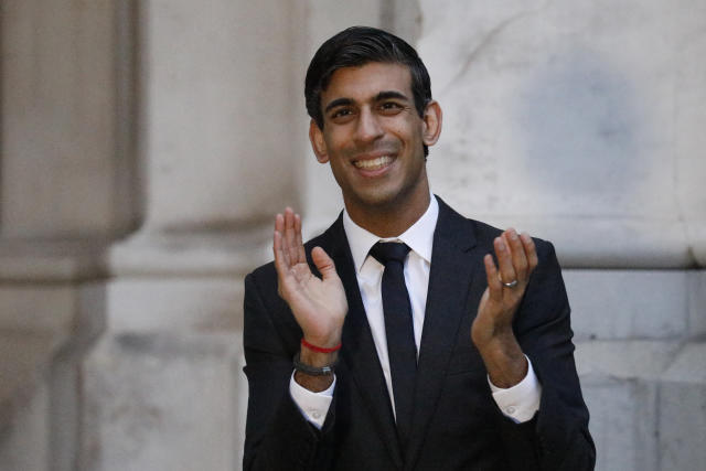 Chancellor of the Exchequer Rishi Sunak clapping outside the Foreign and Commonwealth Office in London to salute local heroes during Thursday's nationwide Clap for Carers initiative to recognise and support NHS workers and carers fighting the coronavirus pandemic.