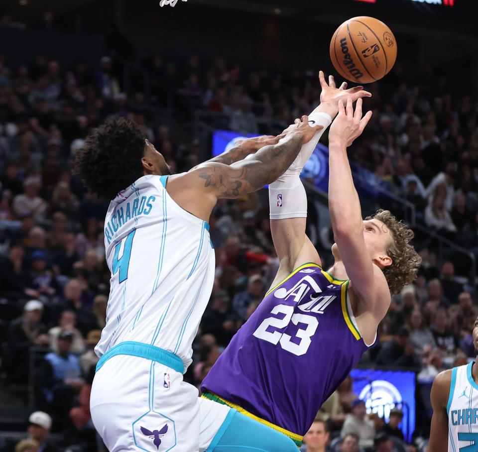 Utah Jazz forward Lauri Markkanen (23) tries to shoot over Charlotte Hornets center Nick Richards (4) in Salt Lake City on Thursday, Feb. 22, 2024. The Hornets won 115-107. | Jeffrey D. Allred, Deseret News