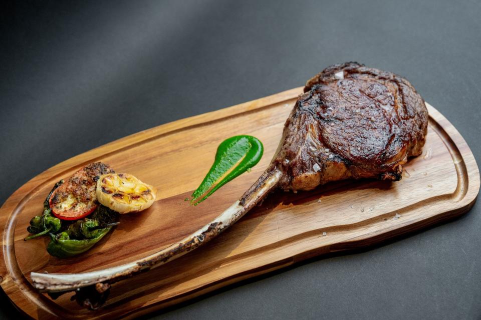 West Palm Beach's new Pink Steak restaurant offers a variety of steaks and chops, including this tomahawk-cut steak.
