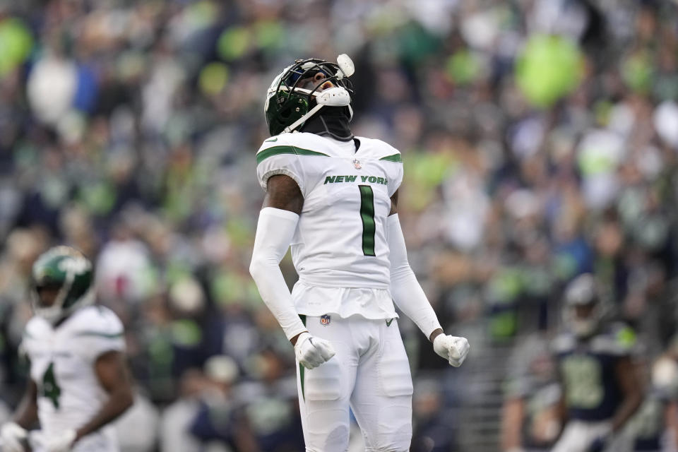 New York Jets cornerback Sauce Gardner (1) celebrates a defensive stop against the Seattle Seahawks during the first half of an NFL football game, Sunday, Jan. 1, 2023, in Seattle. (AP Photo/Godofredo A. Vásquez)