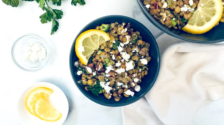 lentil salad in black bowl