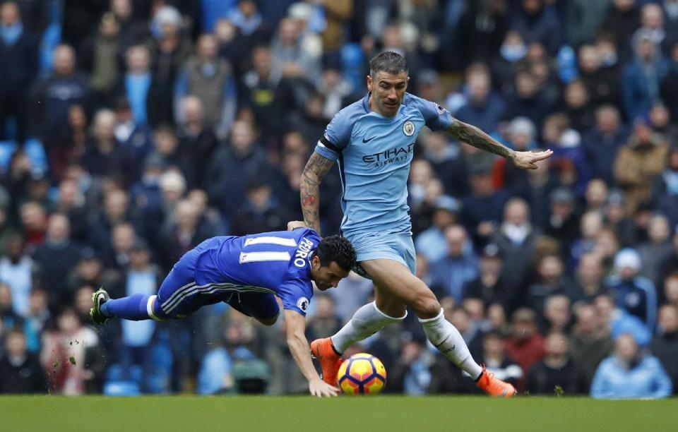 Britain Football Soccer - Manchester City v Chelsea - Premier League - Etihad Stadium - 3/12/16 Manchester City's Aleksandar Kolarov in action with Chelsea's Pedro Reuters / Phil Noble Livepic EDITORIAL USE ONLY. No use with unauthorized audio, video, data, fixture lists, club/league logos or "live" services. Online in-match use limited to 45 images, no video emulation. No use in betting, games or single club/league/player publications. Please contact your account representative for further details.