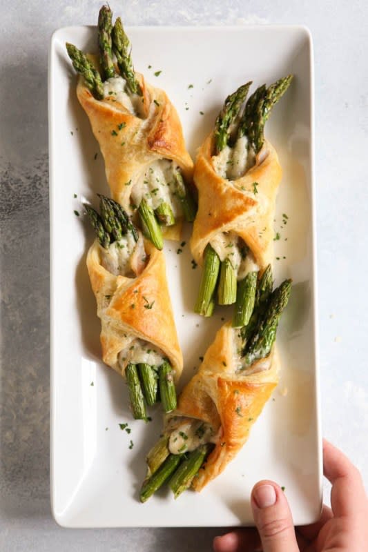 <p>Completely Delicious</p><p>These little bundles of springtime are perfect for Easter dinner—asparagus, pancetta and parmesan cheese wrapped in flaky puff pastry.</p><p><strong>Get the recipe: <a href="https://www.completelydelicious.com/asparagus-pancetta-puff-pastry-bundles/" rel="nofollow noopener" target="_blank" data-ylk="slk:Asparagus Pancetta Puff Pastry Bundles;elm:context_link;itc:0;sec:content-canvas" class="link ">Asparagus Pancetta Puff Pastry Bundles</a></strong></p>