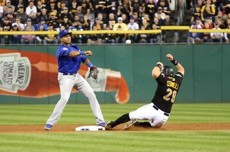 Oct 7, 2015; Pittsburgh, PA, USA; (Editors note: Caption correction) Chicago Cubs second baseman Starlin Castro (13) turns a double play over Pittsburgh Pirates catcher Francisco Cervelli (29) during the seventh inning in the National League Wild Card playoff baseball game at PNC Park. Charles LeClaire-USA TODAY Sports