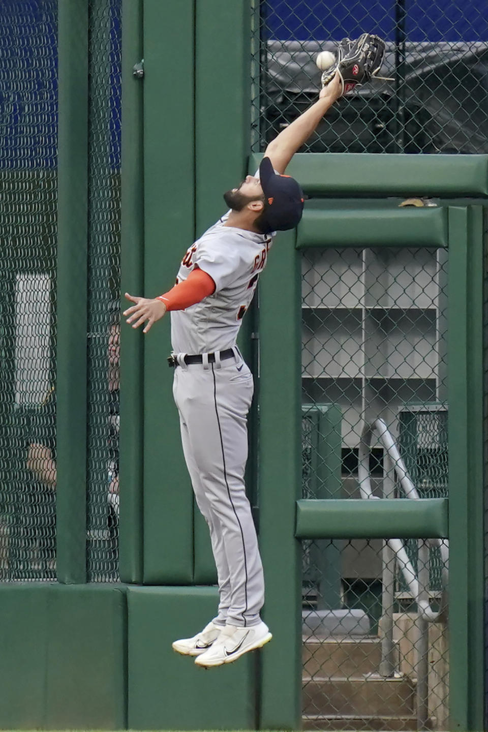 Detroit Tigers center fielder Riley Greene reaches for a triple hit by Pittsburgh Pirates' Endy Rodriguez during the second inning of a baseball game in Pittsburgh, Tuesday, Aug. 1, 2023. (AP Photo/Matt Freed)