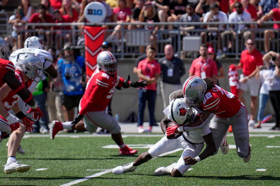 September 10, 2022; Columbus, Ohio, USA; Arkansas State Red Wolves quarterback James Blackman (1) is tackled by Ohio State Buckeyes linebacker Steele Chambers (22) at Ohio Stadium. Mandatory Credit: Joseph Scheller-The Columbus Dispatch