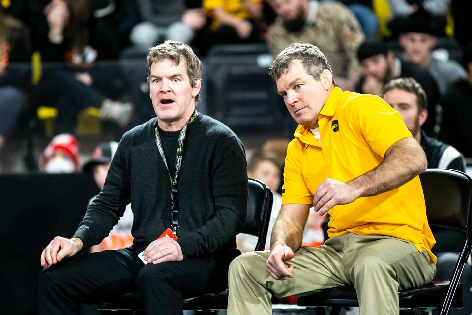 owa associate head coach Terry Brands, left, and Iowa head coach Tom Brands in the finals during the Soldier Salute college wrestling tournament.