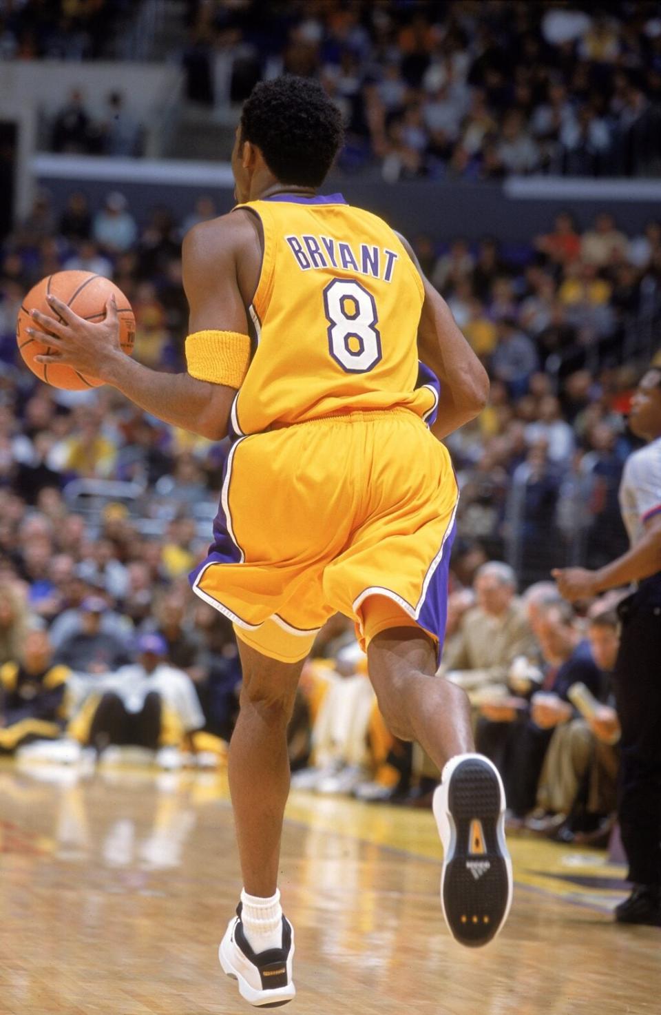 Kobe Bryant #8 of the Los Angeles Lakers dribbles the ball down court during the game against the Dallas Mavericks at the STAPLES Center in Los Angeles, California. (Credit: Robert Laberge /Allsport)