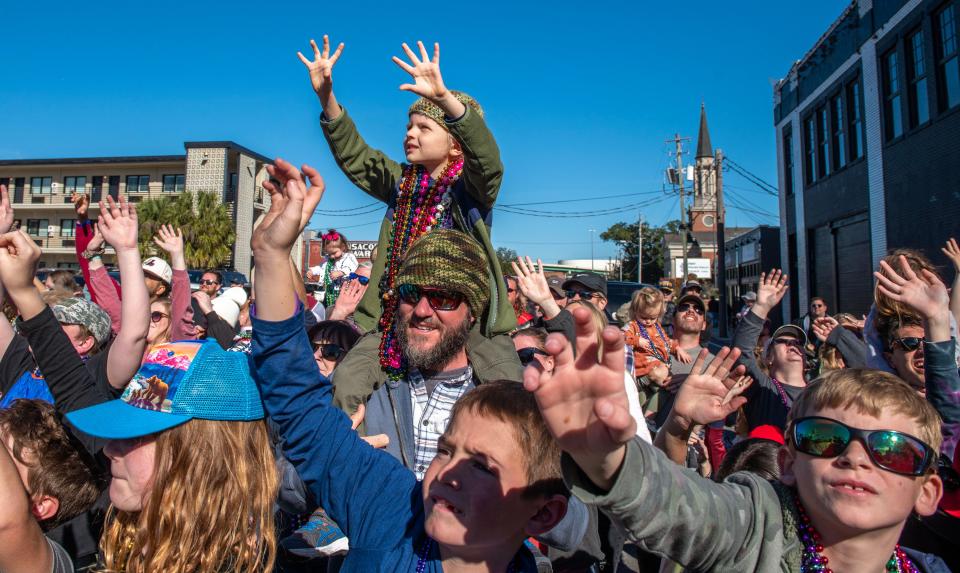 Thousands of revelers let the good times roll during the Pensacola Grand Mardi Gras Parade Saturday, Feb. 18, 2023 in downtown Pensacola.