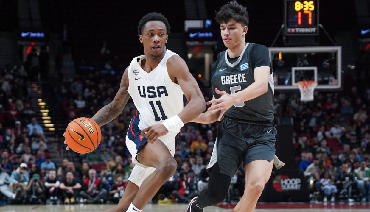 Ron Holland from Team USA drives the lane against Andrej Stojakovic from the World team at the Nike Hoop Summit in Portland, Oregon (courtesy of USA Basketball) 