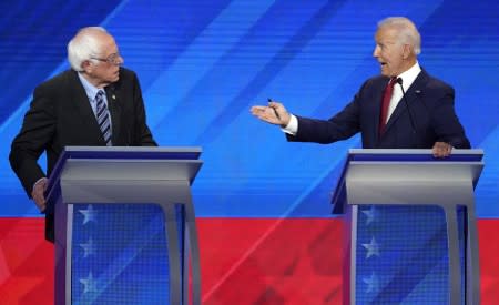 Former Vice President Biden speaks to Senator Sanders during the 2020 Democratic U.S. presidential debate in Houston, Texas, U.S.