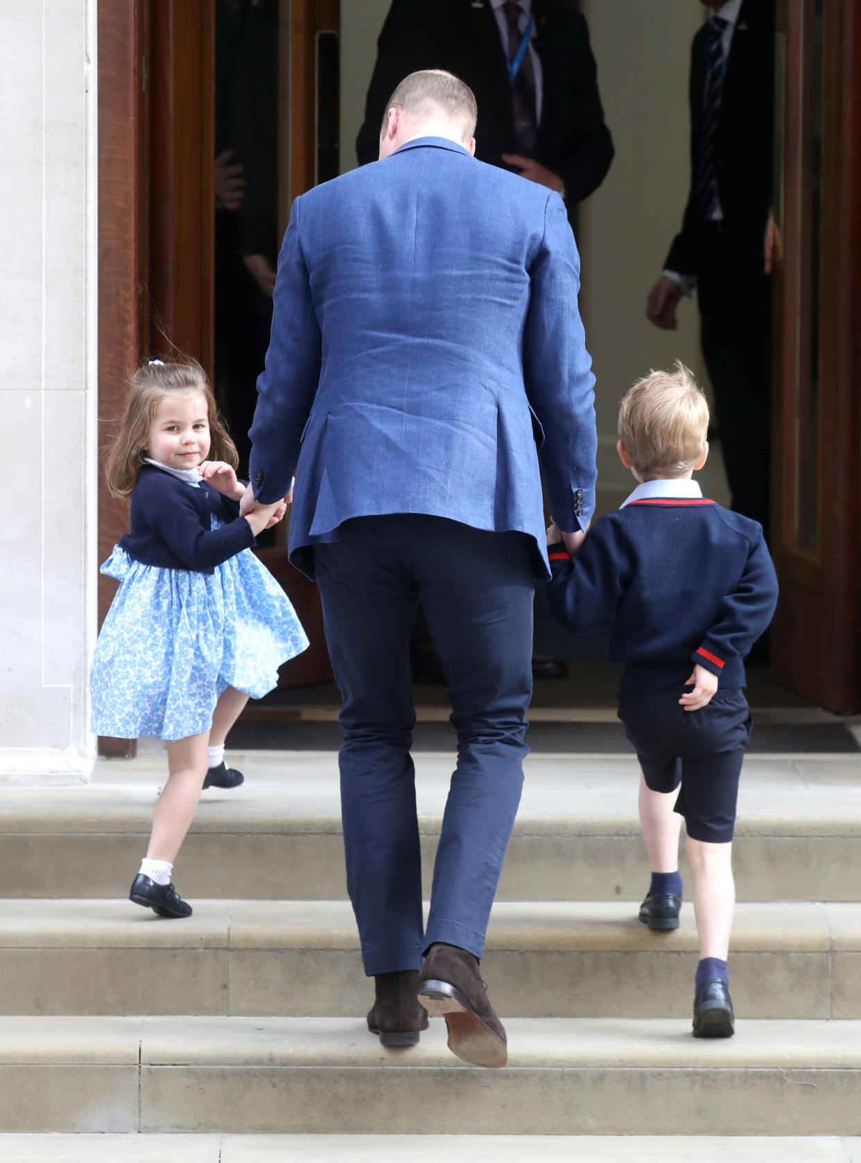 Prince William brings Princess Charlotte and Prince George to the Lindo Wing at St. Mary’s Hospital in London to meet their new baby brother. (Photo: Getty Images)