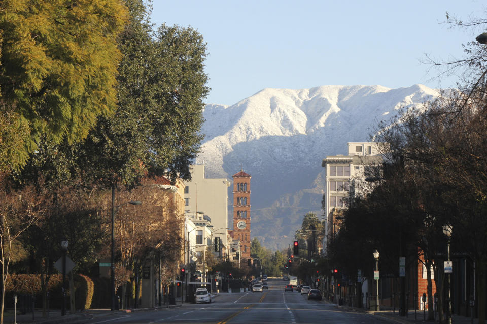 Snow glistens on mountain peaks above Pasadena, Calif., on Sunday, Feb. 26, 2023, after a major winter storm swept the state. Snow fell to unusually low elevations in Southern California. (AP Photo / John Antczak)