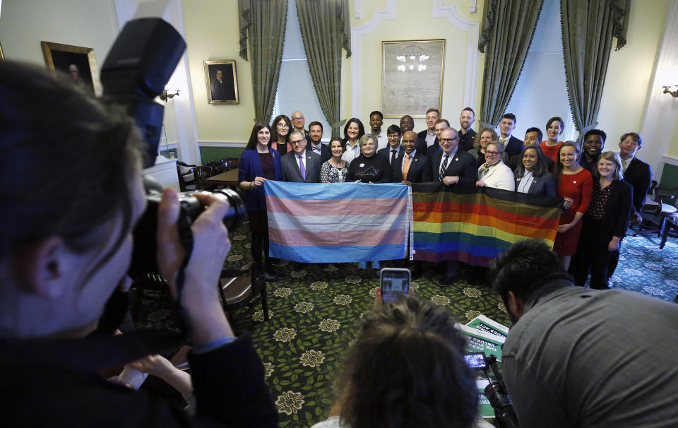 Image: Supporters of SB 868 gather for a group photo after a press conference ahead of the floor votes on SB 868, the Virginia Values Act. The event was held in the Jefferson Room of the State Capitol in Richmond,