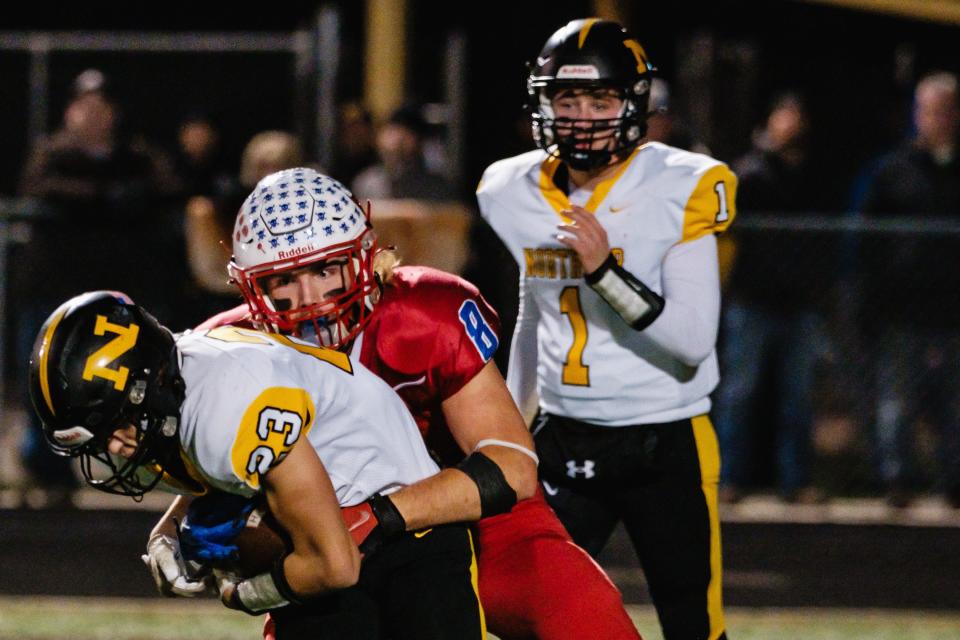 Garaway's Jackson Reifenschneider takes down Northmor's Carson Campbell during a week 13 division 6 high school football playoff game, Friday, Nov. 3 at Bulldog Stadium in Heath, Ohio.