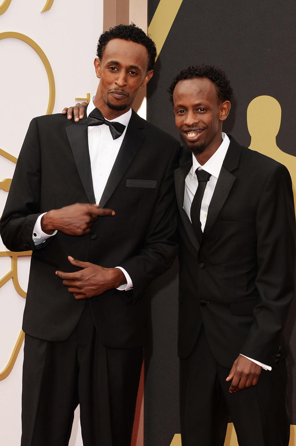 Actors Faysal Ahmed (L) and Barkhad Abdi attends the Oscars