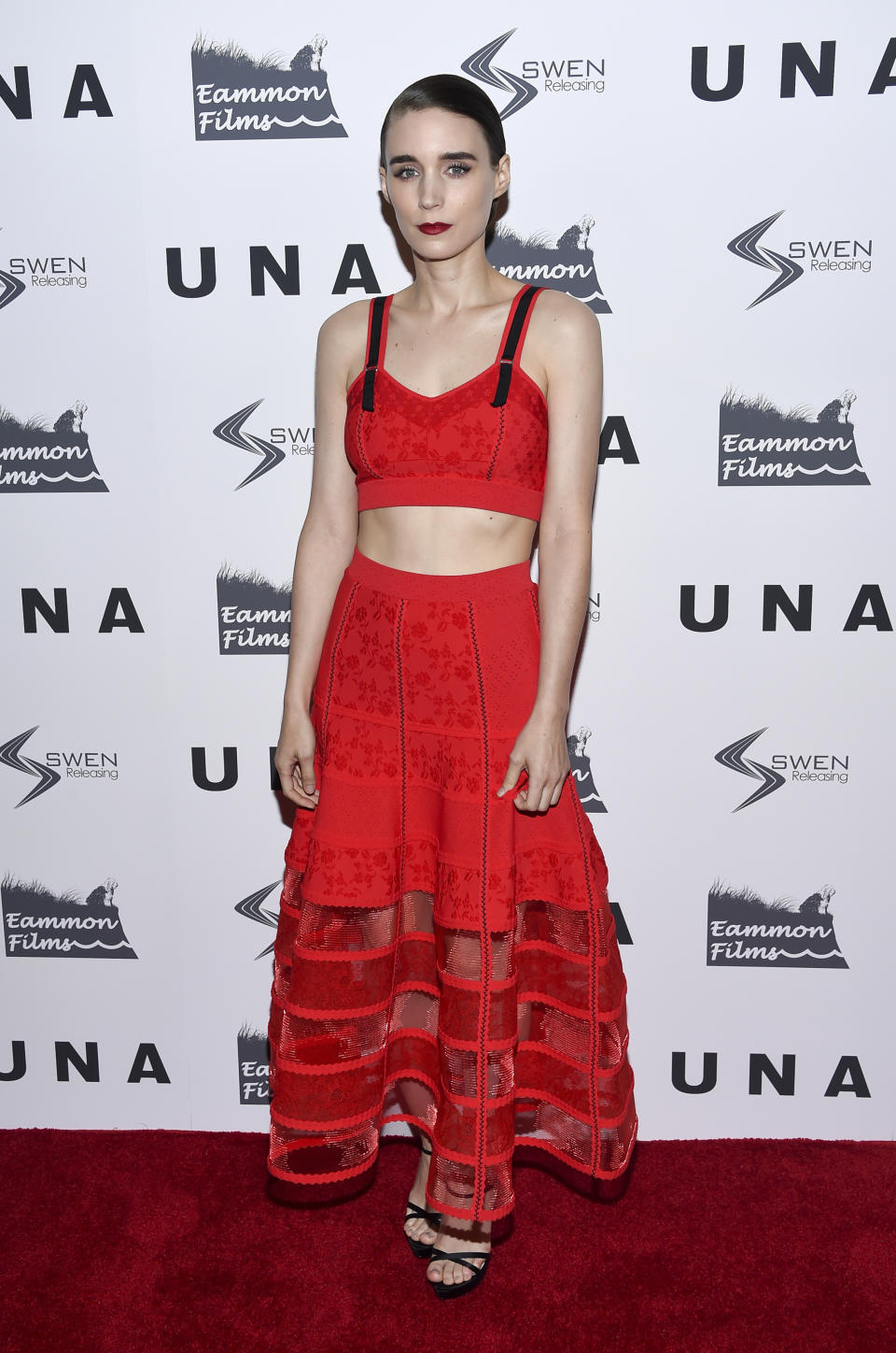 <p>Rooney definitely wasn’t a wallflower in this vibrant red two-piece by Alexander McQueen.<br><em>[Photo: AP]</em> </p>