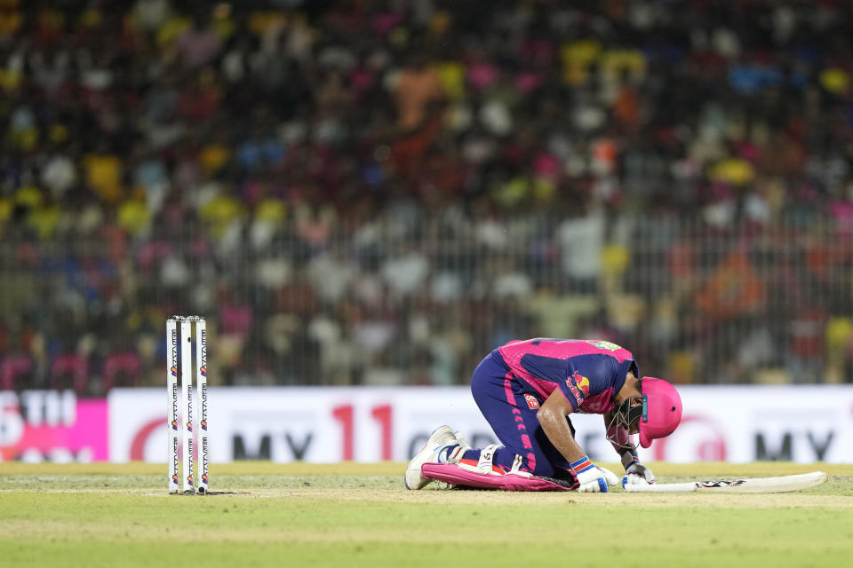 Rajasthan Royals' Dhruv Jurel crouches on the ground after getting hit by the ball on his throat as he bats during the Indian Premier League second qualifier cricket match between Rajasthan Royals and Sunrisers Hyderabad in Chennai, India, Friday, May 24, 2024. (AP Photo /Mahesh Kumar A.)