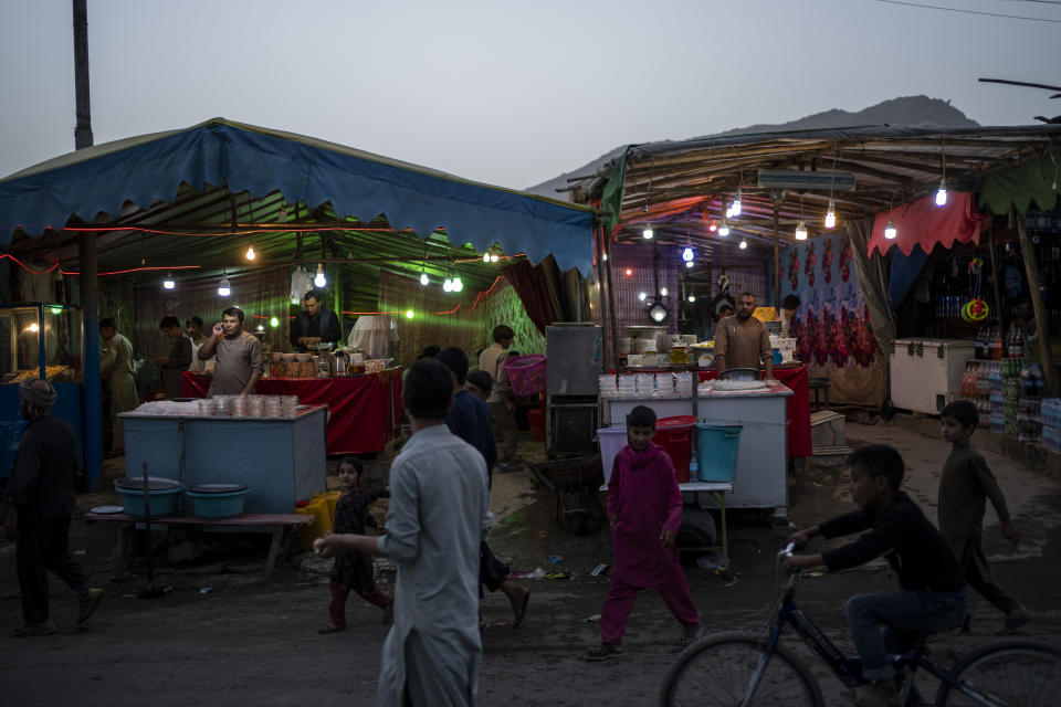 Local vendors wait for customers in Kabul, Afghanistan, Friday, Sept. 10, 2021. (AP Photo/Bernat Armangue)