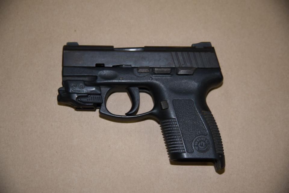 Nassau County crime scene detectives found a Taurus .45 caliber handgun in the victim's vehicle.