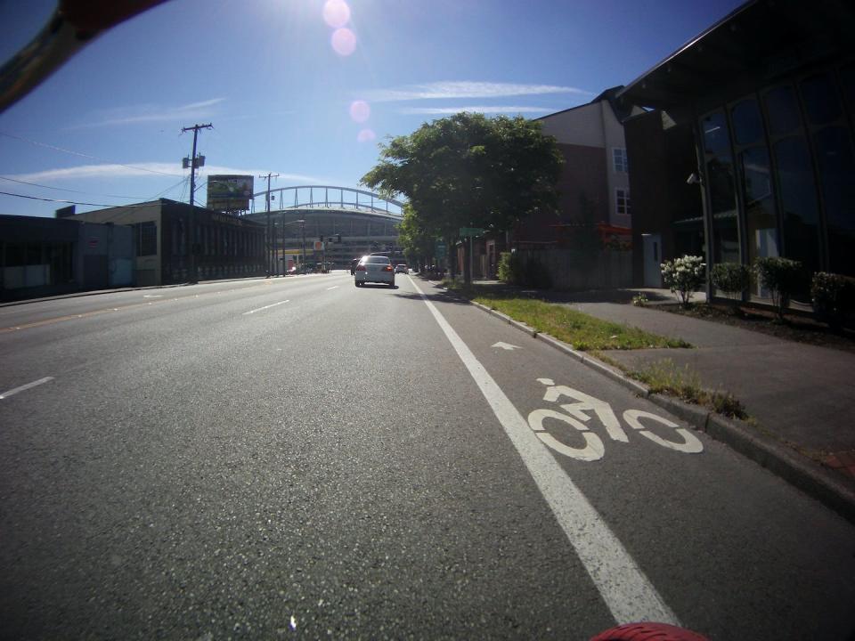 Substandard bike lanes, like this one in Seattle, expose cyclists to unsafe passing by motorists and collisions with cars turning right at intersections or pulling out of driveways. <a href="https://flic.kr/p/eEHMuy" rel="nofollow noopener" target="_blank" data-ylk="slk:Joshua Putnam;elm:context_link;itc:0;sec:content-canvas" class="link ">Joshua Putnam</a>, <a href="http://creativecommons.org/licenses/by/4.0/" rel="nofollow noopener" target="_blank" data-ylk="slk:CC BY;elm:context_link;itc:0;sec:content-canvas" class="link ">CC BY</a>