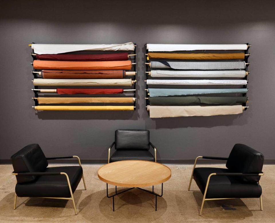 Bolts of fabric adorn a wall as art at Dickies Quality Workwear and Apparel offices in downtown Fort Worth Texas, Thursday Mar. 28, 2024. The 102 year old work apparel company recently relocated to downtown Fort Worth.