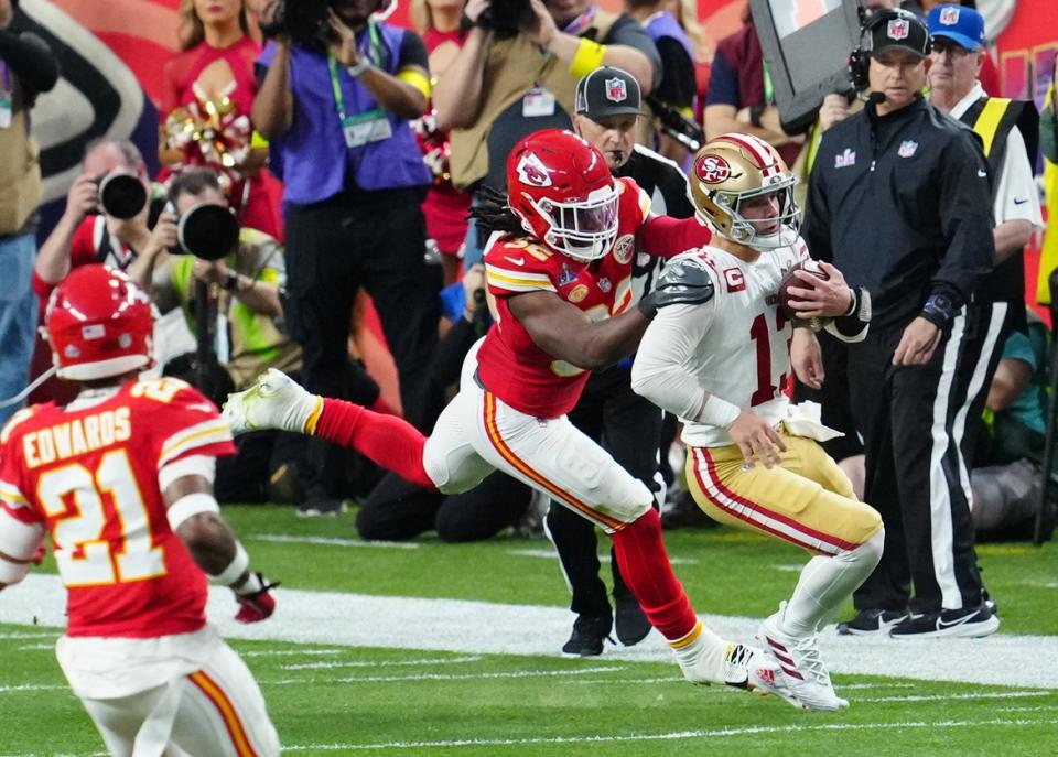 Feb 11, 2024; Paradise, Nevada, USA; San Francisco 49ers quarterback Brock Purdy (13) is tackled by Kansas City Chiefs linebacker Nick Bolton (32) in the first half in Super Bowl LVIII at Allegiant Stadium. Mandatory Credit: Stephen R. Sylvanie-USA TODAY Sports