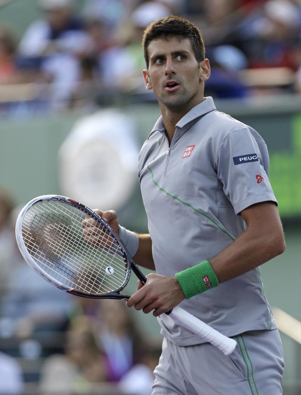 Novak Djokovic, of Serbia, pumps his fist after winning 7-5, 6-3 against Andy Murray, of Britain, at the Sony Open Tennis tournament in Key Biscayne, Fla., Wednesday, March 26, 2014. (AP Photo/Alan Diaz)