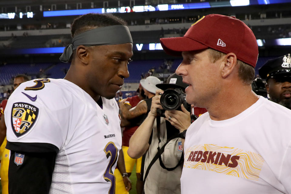 BALTIMORE, MD - AUGUST 30: Robert Griffin III #3 of the Baltimore Ravens shakes hands with head coach Jay Gruden of the Washington Redskins following a preseason game at M&T Bank Stadium on August 30, 2018 in Baltimore, Maryland. (Photo by Rob Carr/Getty Images)