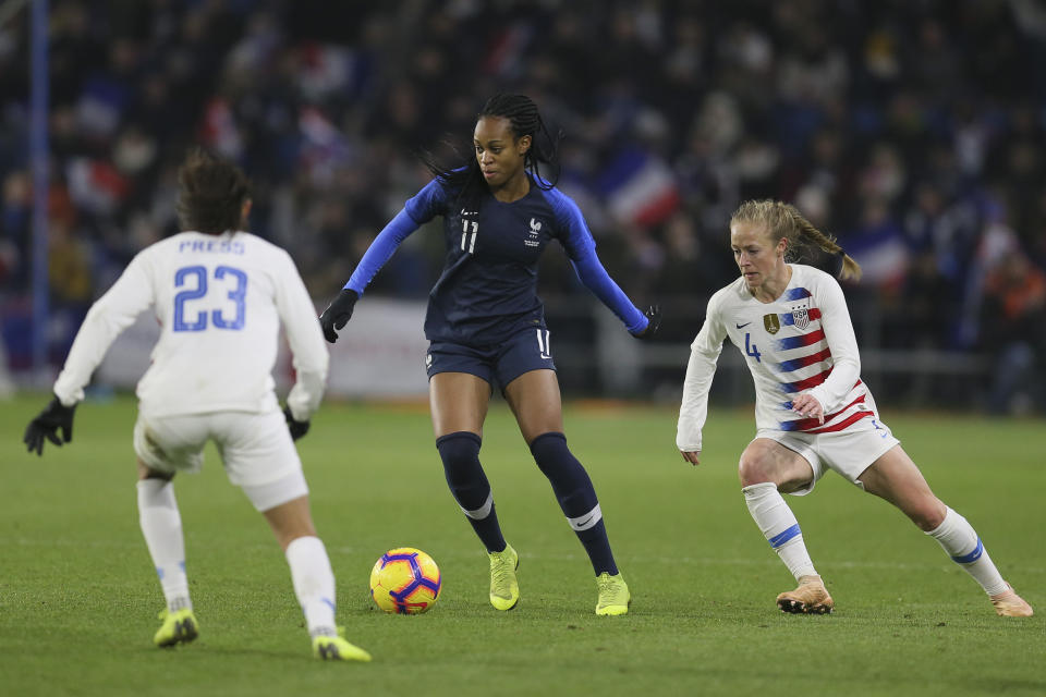 France forward Marie-Antoinette Katoto, centre, vies for the ball with US forward Christen Press, left, and defender Becky Sauerbrunn during a women's international friendly soccer match between France and United States at the Oceane stadium in Le Havre, France, Saturday, Jan. 19, 2019. Katoto scored once in France's 3-1 victory. (AP Photo/David Vincent)