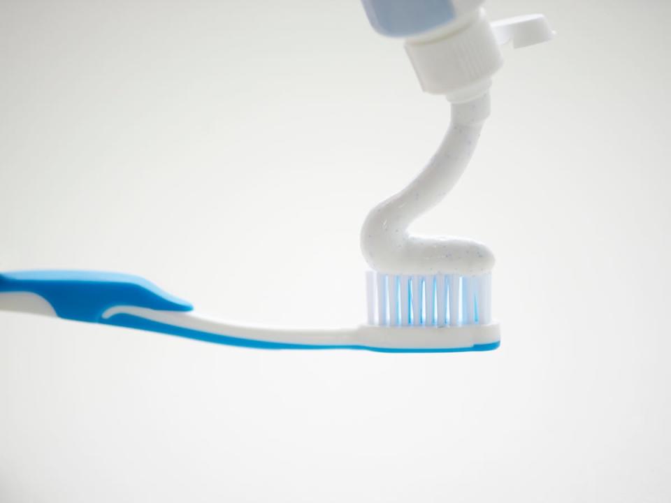 toothpaste on toothbrush - fluoride free toothpaste 2022