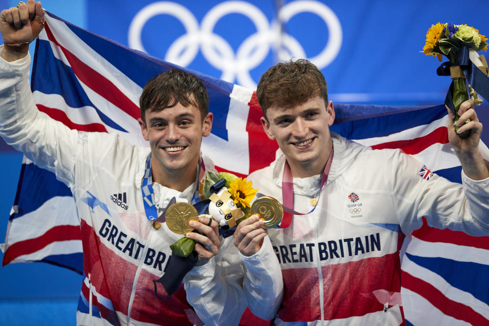 TOKYO, JAPAN - JULY 26: (BILD ZEITUNG OUT) Matty Lee and Thomas Daley of Great Britain celebrate with their gold medals during the medal presentation for the Men's Synchronised 10m Platform Final compete during the Men's Synchronised 10m Platform Final on day three of the Tokyo 2020 Olympic Games at Tokyo Aquatics Centre on July 26, 2021 in Tokyo, Japan. (Photo by Berengui/DeFodi Images via Getty Images)