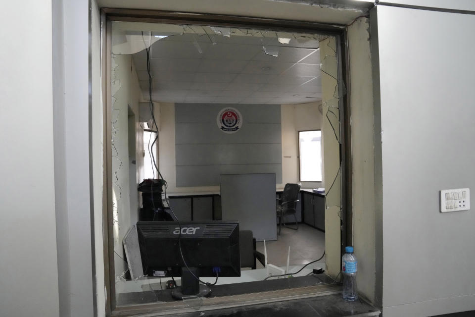 A damaged area of police station in Warburton, an area of district Nankana, Pakistan, Sunday, Feb. 12, 2023. Hundreds of Muslims descended on a police station in Pakistan's eastern Punjab province on Saturday, snatched Waris, a blasphemy suspect from his cell and took him outside and lynched him, police said. (AP Photo/K.M. Chaudary)