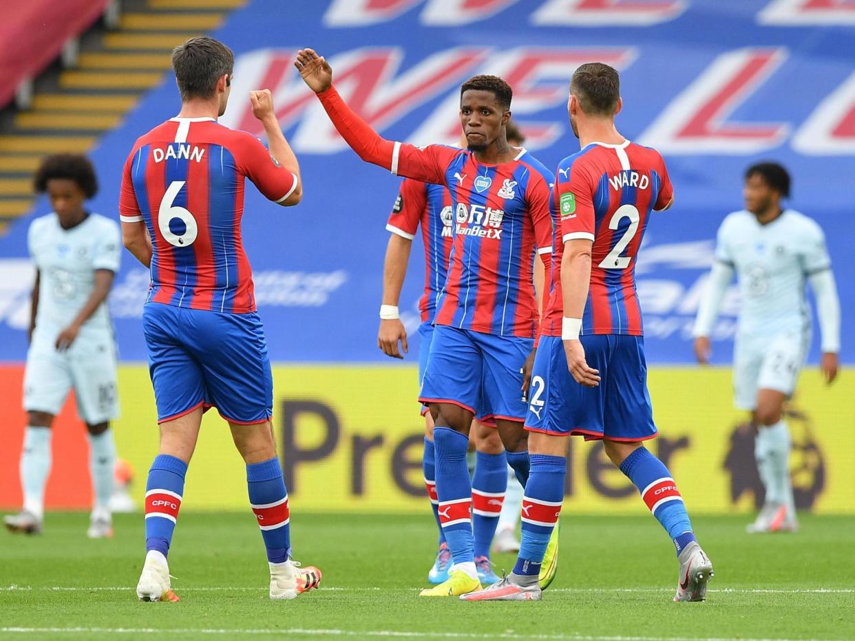 Zaha celebrates after his scorching strike halves the deficit: Getty