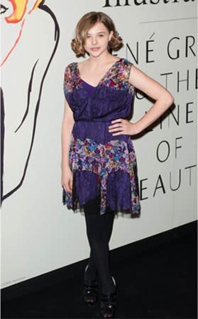 At a private viewing of the "Dior Illustrated" exhibit in 2010, Chloë wore a purple lace dress with floral paneling. <em>Dress, Dior.</em>