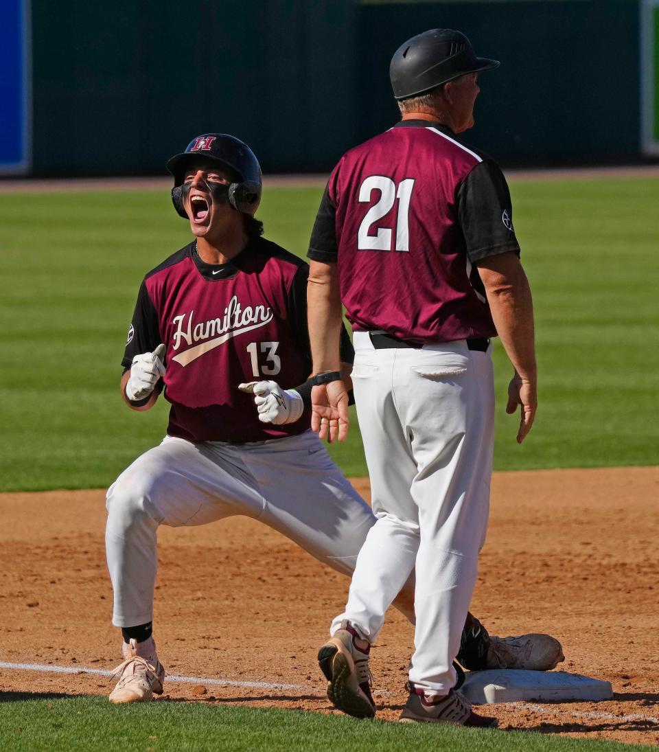 Hamilton infielder Roch Cholowsky (13) celebrates a triple against Sandra Day O’Connor during a 6A State Semifinal game on May 12, 2023, at Hohokam Stadium in Mesa.