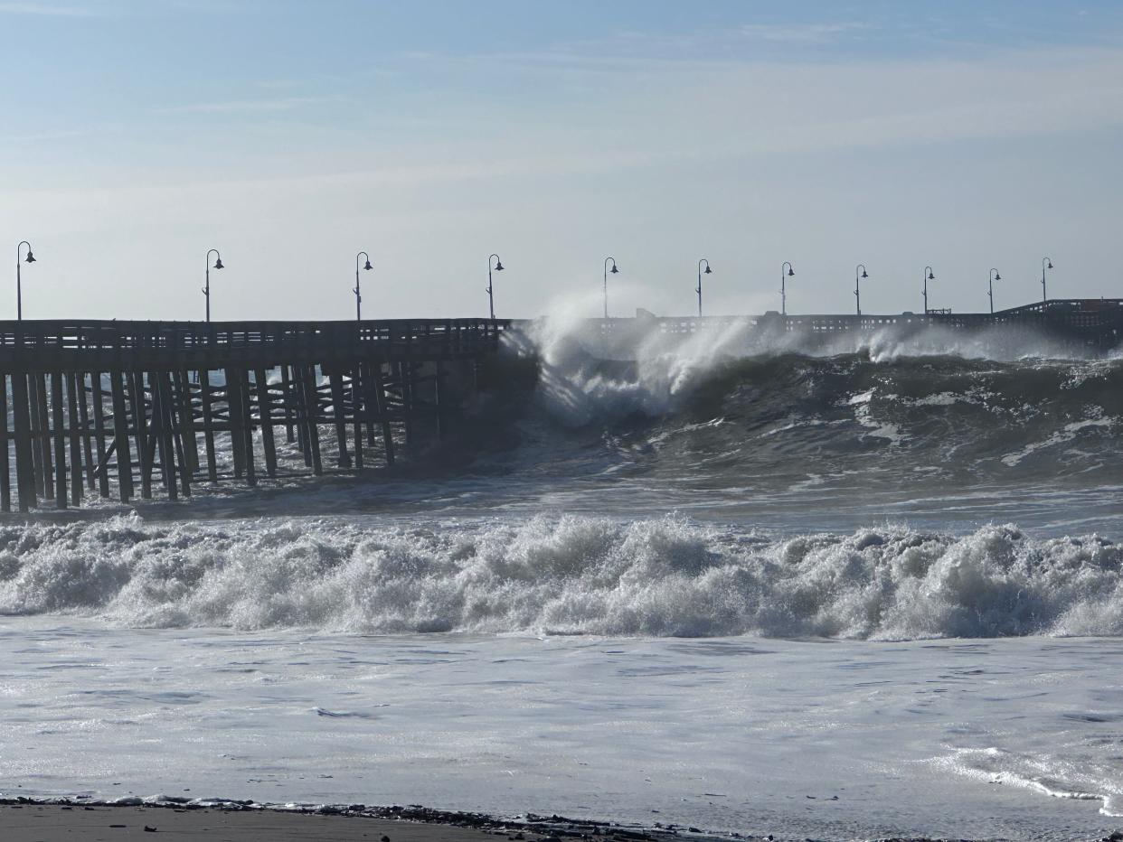 Waves crash into the Ventura Pier on Dec. 28 during high surf conditions. The scheduled reopening of the Ventura Pier has been delayed until summer after December's heavy surf caused more damage.