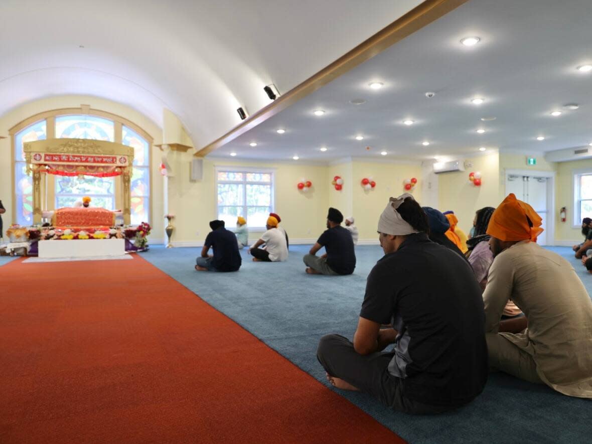 Worshippers are shown at the Maritime Sikh Society's new gurdwara on Sunday. (Jeorge Sadi/CBC - image credit)
