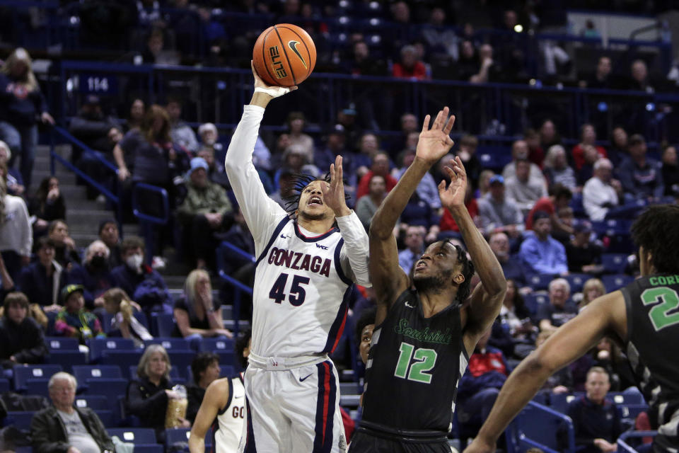 Gonzaga guard Rasir Bolton (45) shoots while defended by Chicago State guard Brent Davis (12) during the second half of an NCAA college basketball game, Wednesday, March 1, 2023, in Spokane, Wash. Gonzaga won 104-65. (AP Photo/Young Kwak)