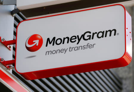 FILE PHOTO: A Moneygram logo is seen outside a bank in Vienna, Austria, June 28, 2016. REUTERS/Heinz-Peter Bader/File Photo