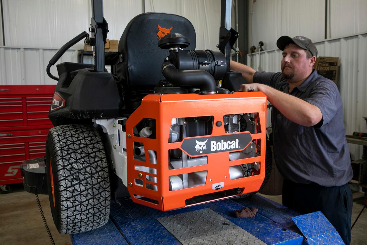 Steven Kessler, Lawn and Garden Services Manager, does a post delivery inspection on a Bobcat lawn mower in the service area at Foltz Ag on Apr. 17, 2024, in Lancaster, Ohio.