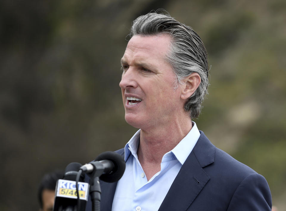 FILE - In this April 23, 2021, file photo, California Gov. Gavin Newsom speaks during a press conference in Big Sur, Calif. The state's population has become a political issue this year in light of the effort to recall Newsom, with Republicans blaming high taxes and the governor's policies for people fleeing the state. (AP Photo/Nic Coury, File)