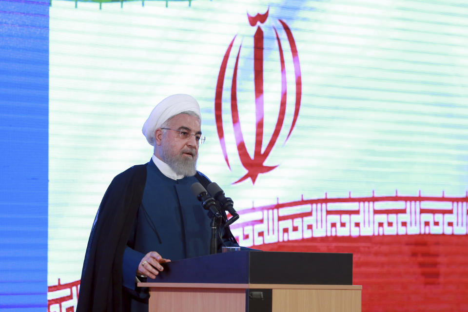 In this photo released by the official website of the office of the Iranian Presidency, President Hassan Rouhani speaks in a ceremony in Tehran, Iran, Tuesday, Aug. 27, 2019. Rouhani back-pedaled Tuesday on possible talks with Donald Trump, saying the U.S. president must first lift sanctions imposed on Tehran, otherwise a meeting between the two would be a mere photo op. (Iranian Presidency Office via AP)