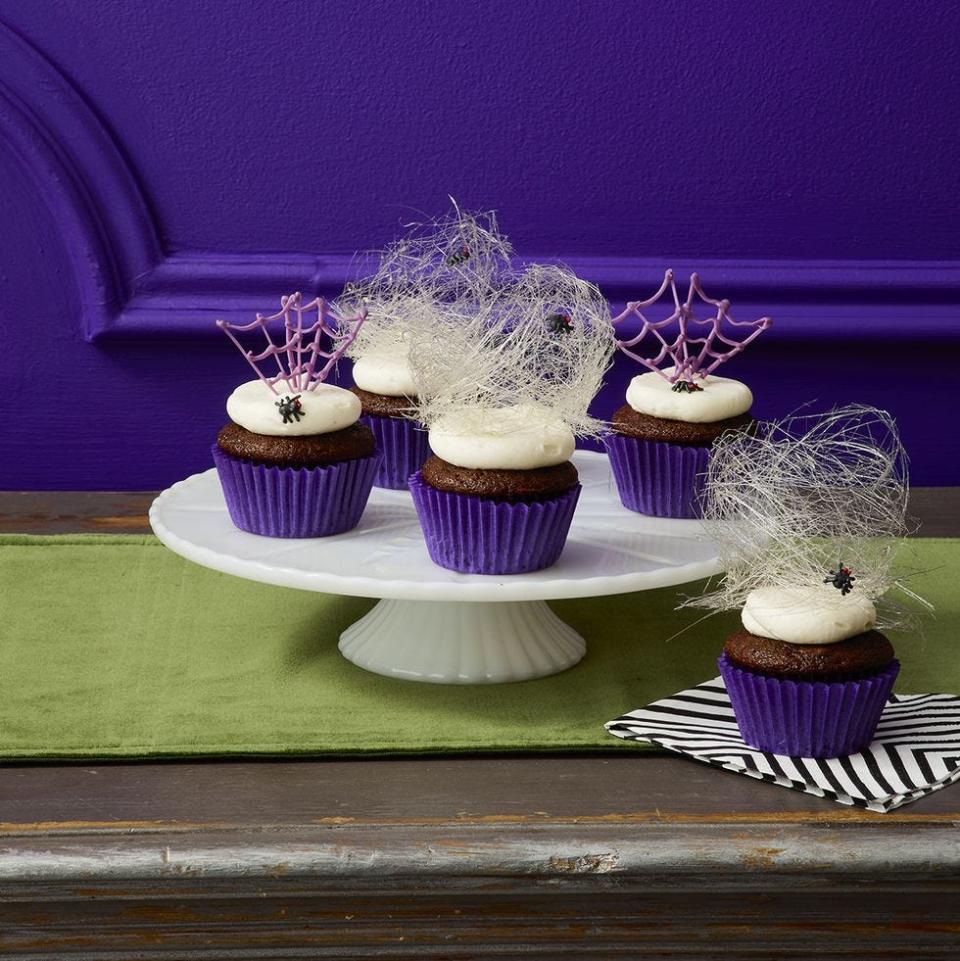 <p>Chocolate cupcakes topped with spun-sugar webs and edible spiders are the perfect way to fright and delight your guests.</p><p>Get the <strong><a href="https://www.womansday.com/food-recipes/food-drinks/a29129422/spider-cupcakes-recipe/" rel="nofollow noopener" target="_blank" data-ylk="slk:Spider Cupcakes recipe;elm:context_link;itc:0;sec:content-canvas" class="link ">Spider Cupcakes recipe</a></strong>.</p>