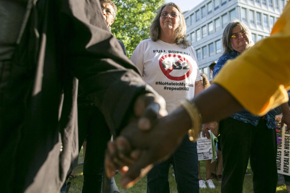 Protestors gather across the street from the North Carolina state legislative building as they voice their concerns over House Bill 2, in Raleigh, N.C., Monday, May 16, 2016. (Al Drago/CQ Roll Call)